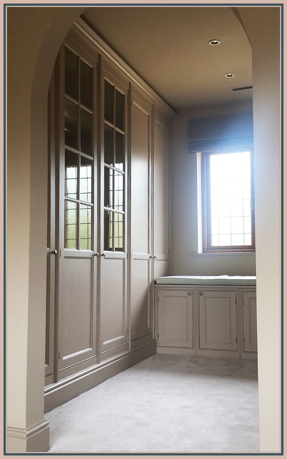 Refinished fitted cabinet painted in a soft grey tone