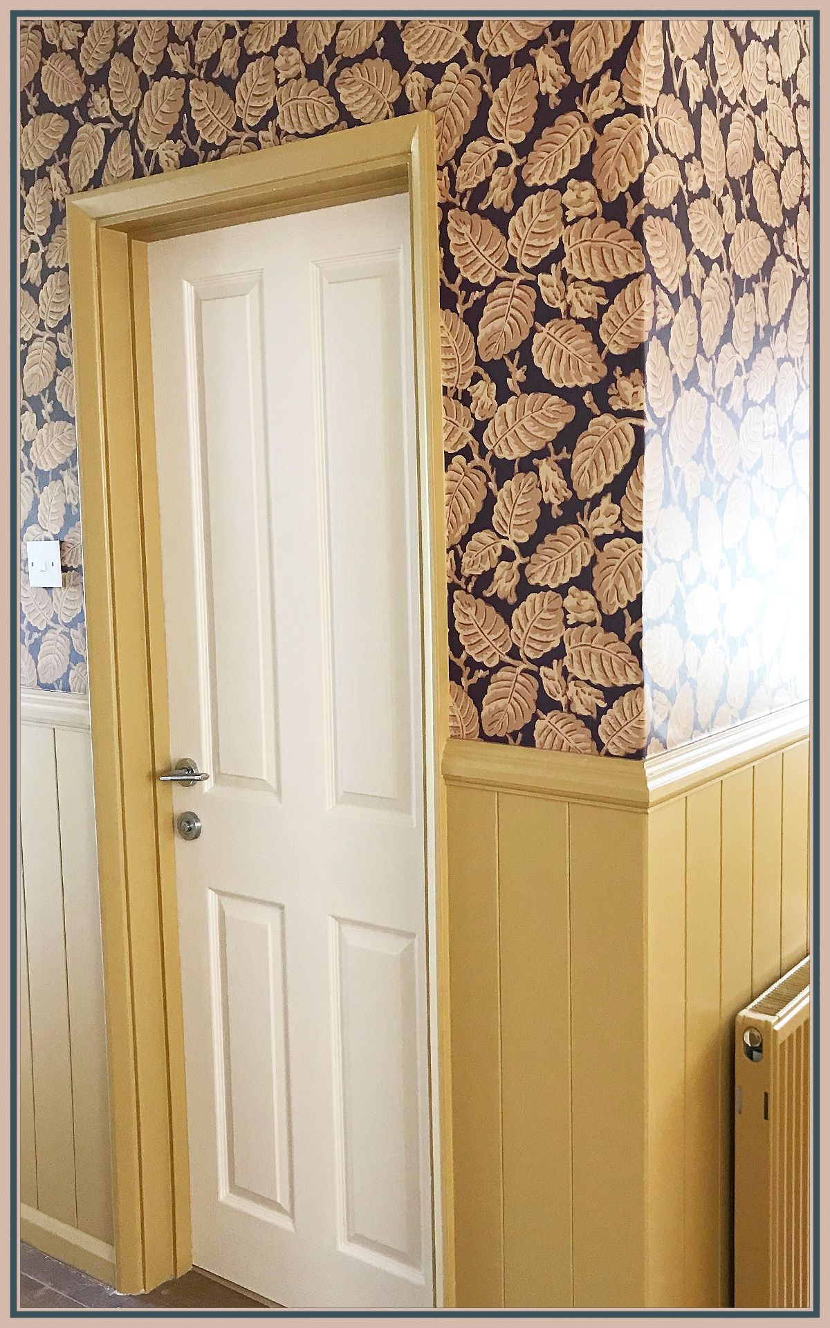 Detailed wallpapering around a corner with a botanical pattern